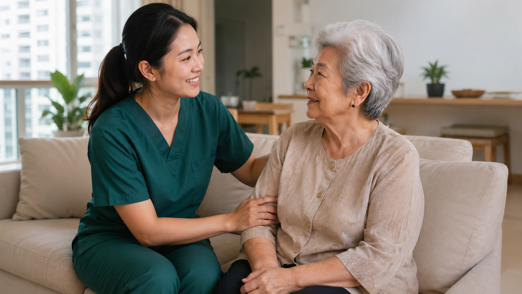 Asian home nurse in dark green scrubs caring for an elderly patient in a Singapore home